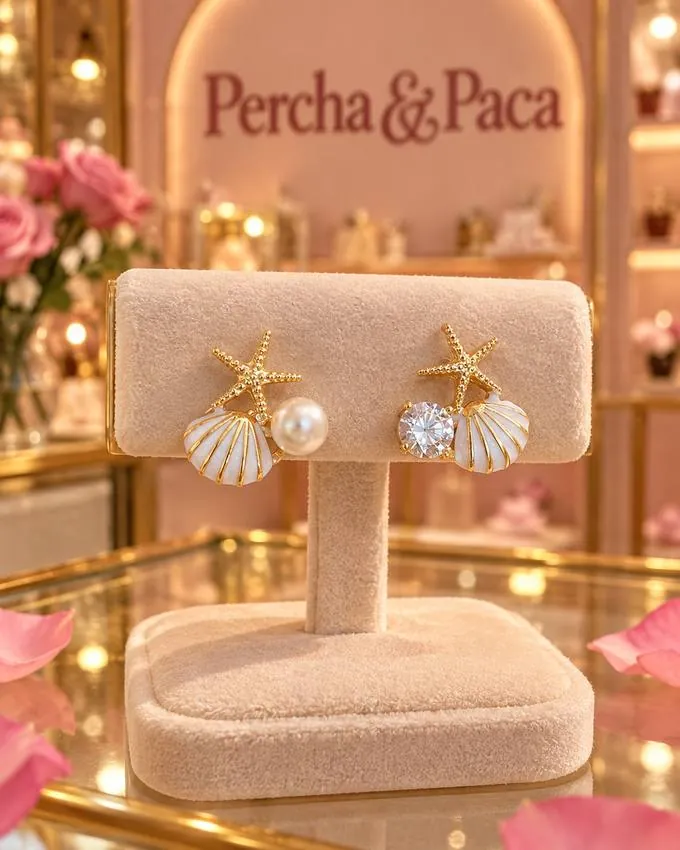 Aretes concha con estrella en la vitrina de Percha & Paca